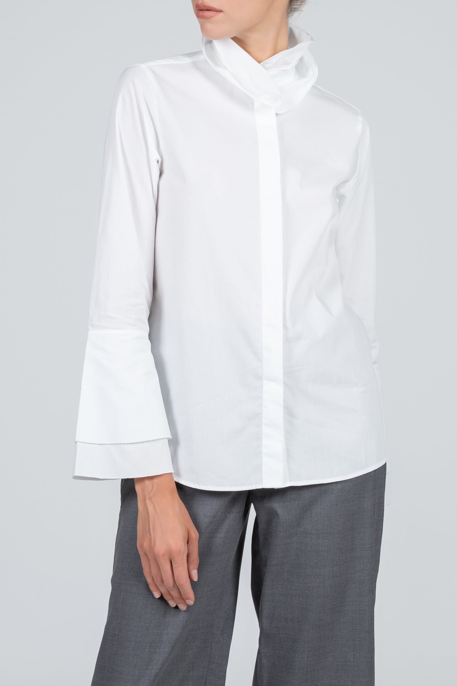 Elegant white women's shirt with ruffle collar